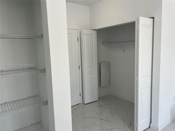a view of an empty walk in closet