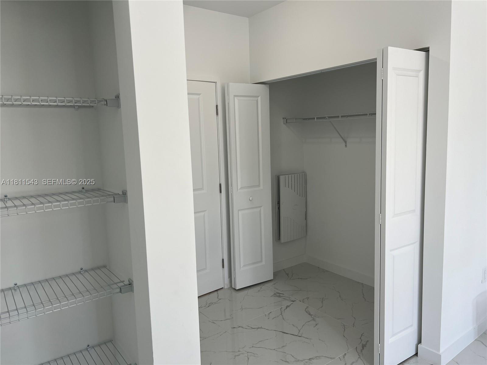 1010 Southwest 69th Avenue, Unit 104 Miami, FL 33144 - Photo 14 of 16 a view of an empty walk in closet