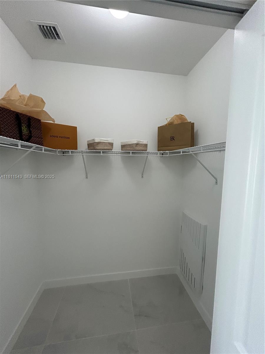 1010 Southwest 69th Avenue, Unit 104 Miami, FL 33144 - Photo 16 of 16 a view of walk in closet