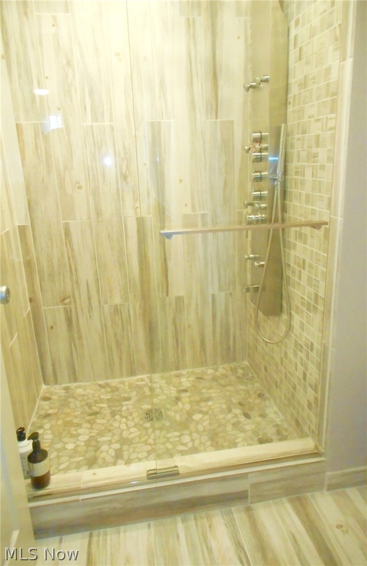 421 Misty Lane Akron, OH 44321 - Photo 21 of 31 Master shower new in 2017 with tiled shower and tiled flooring...tastefully done