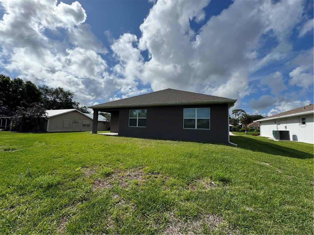 1836 Barber Street Sebastian, FL 32958 - Photo 5 of 29 a front view of a house with garden