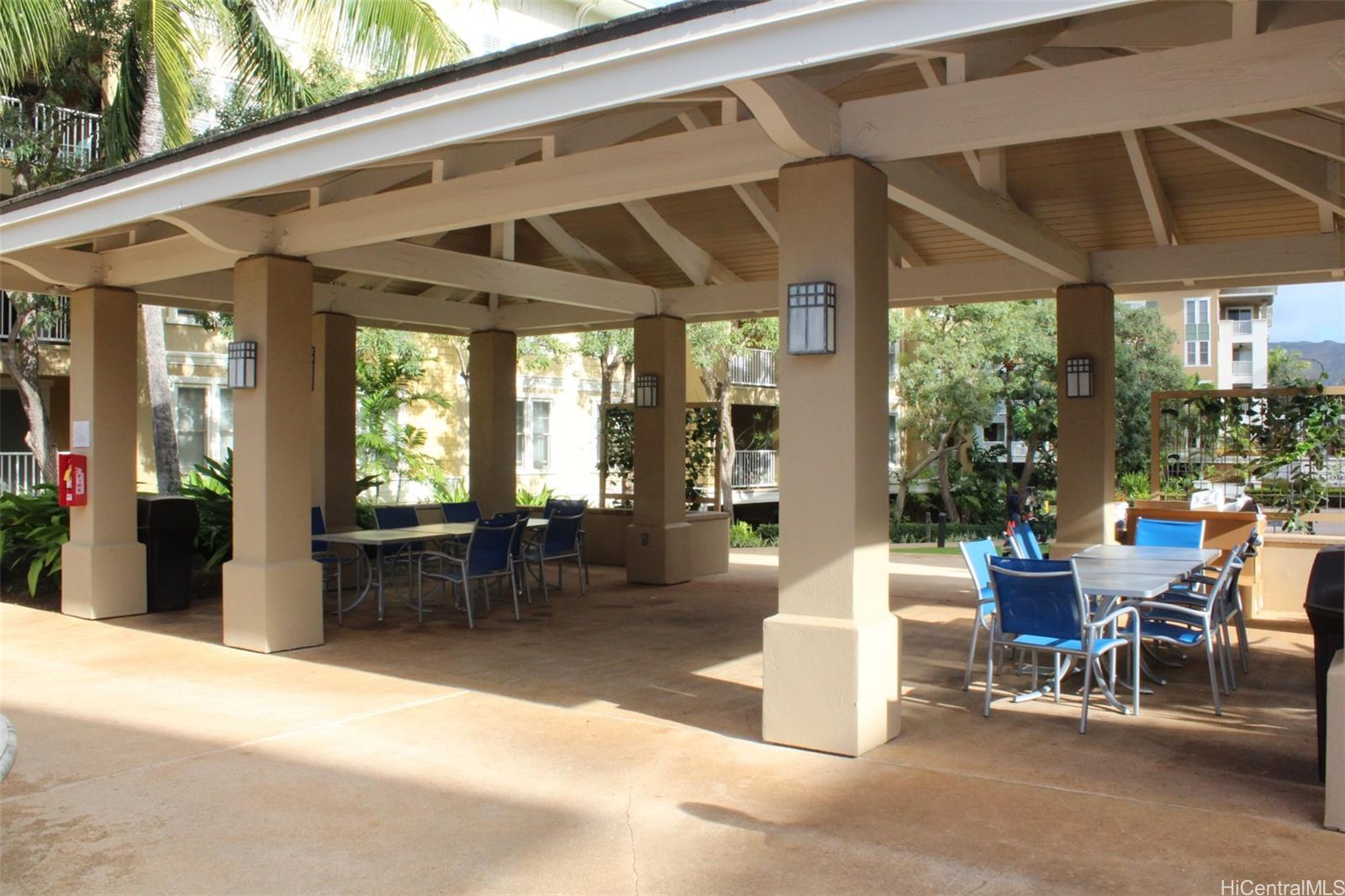 520 Lunalilo Home Road, Unit 7328 Honolulu, HI 96825 - Photo 19 of 22 a patio with a table and chairs