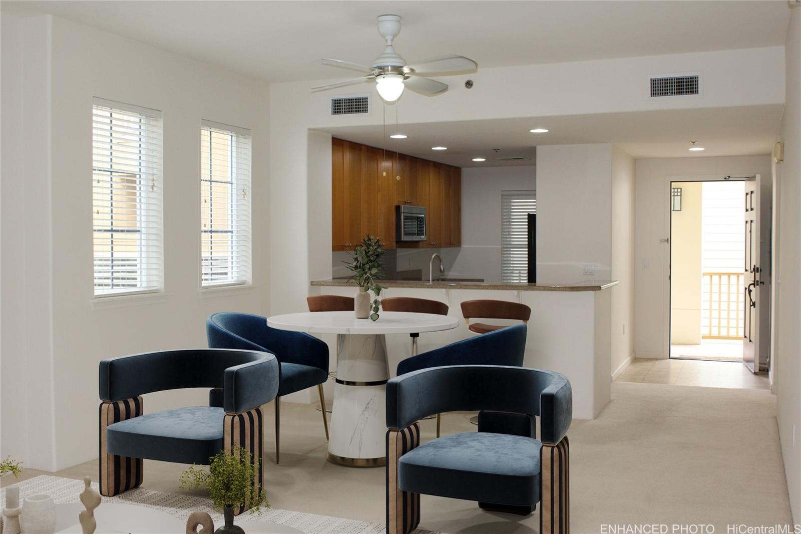 520 Lunalilo Home Road, Unit 7328 Honolulu, HI 96825 - Photo 2 of 22 a view of a dining room with furniture and a chandelier