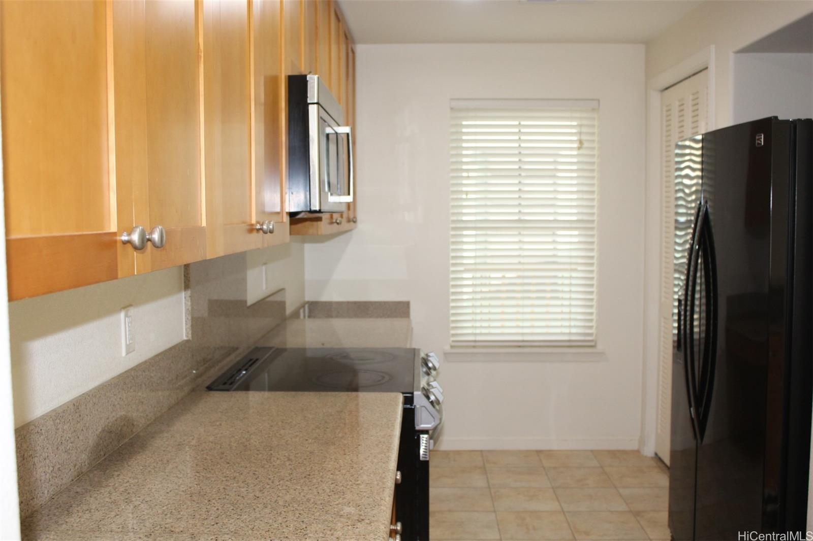 520 Lunalilo Home Road, Unit 7328 Honolulu, HI 96825 - Photo 4 of 22 a bathroom with a sink and a large mirror