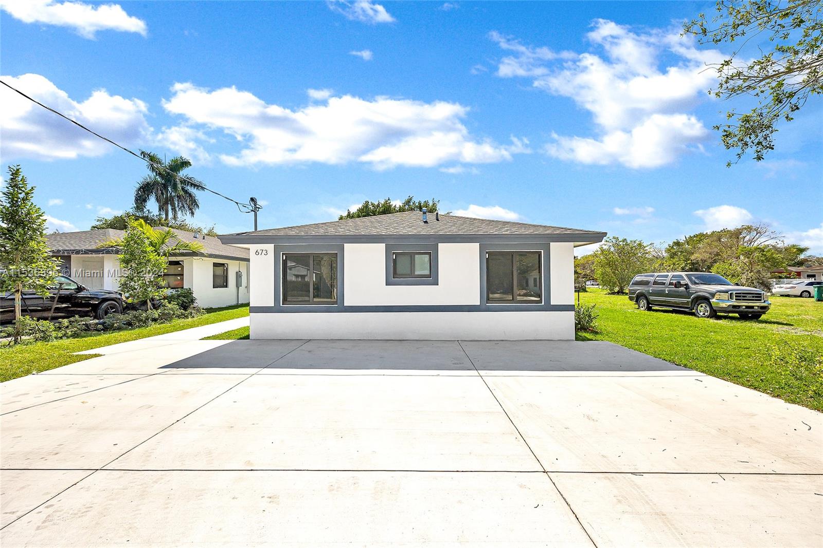 673 Northwest 14th Street, Unit 1 Florida City, FL 33034 - Photo 1 of 20 a house view with a garden space
