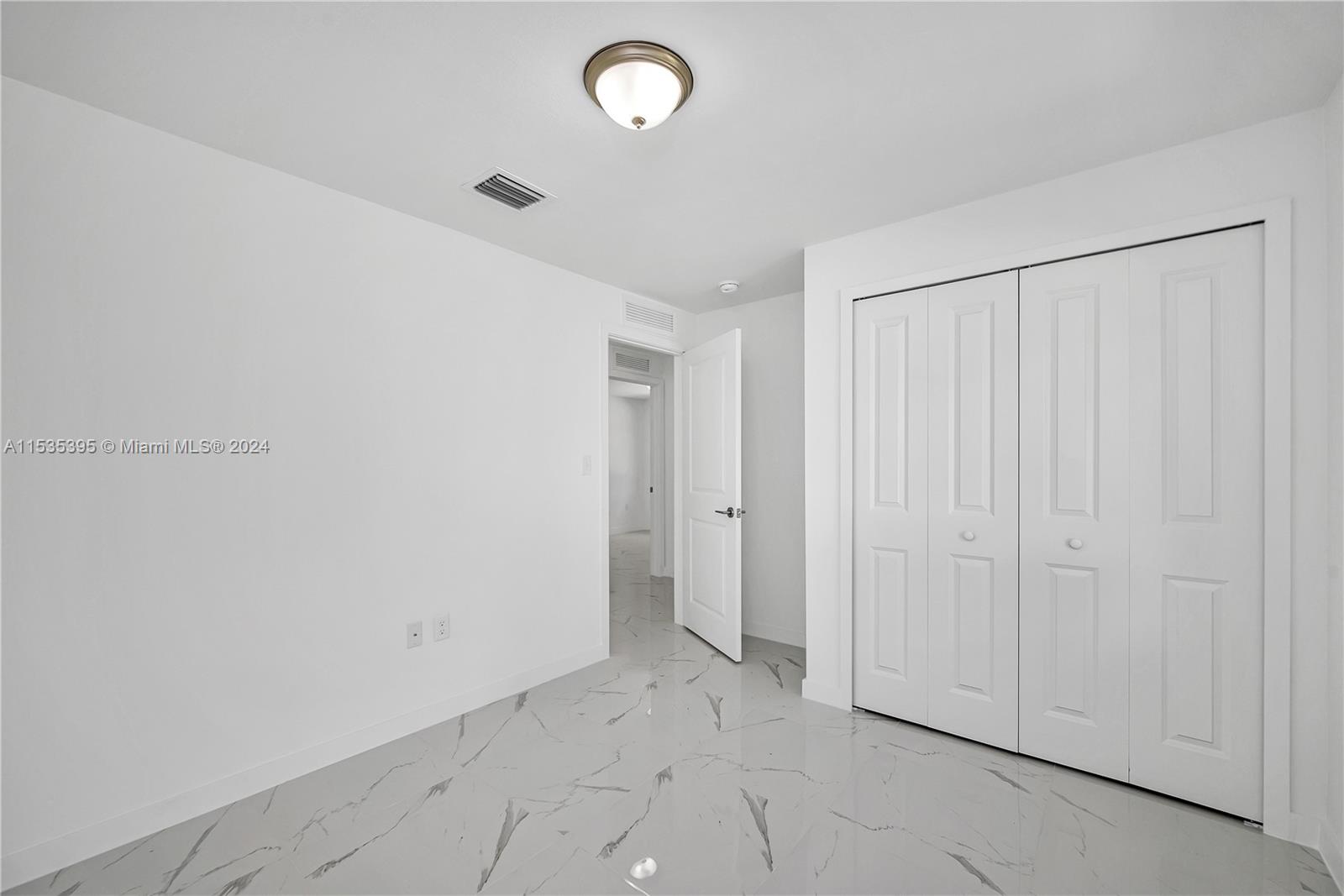 673 Northwest 14th Street, Unit 1 Florida City, FL 33034 - Photo 17 of 20 an empty room with a empty space and a window