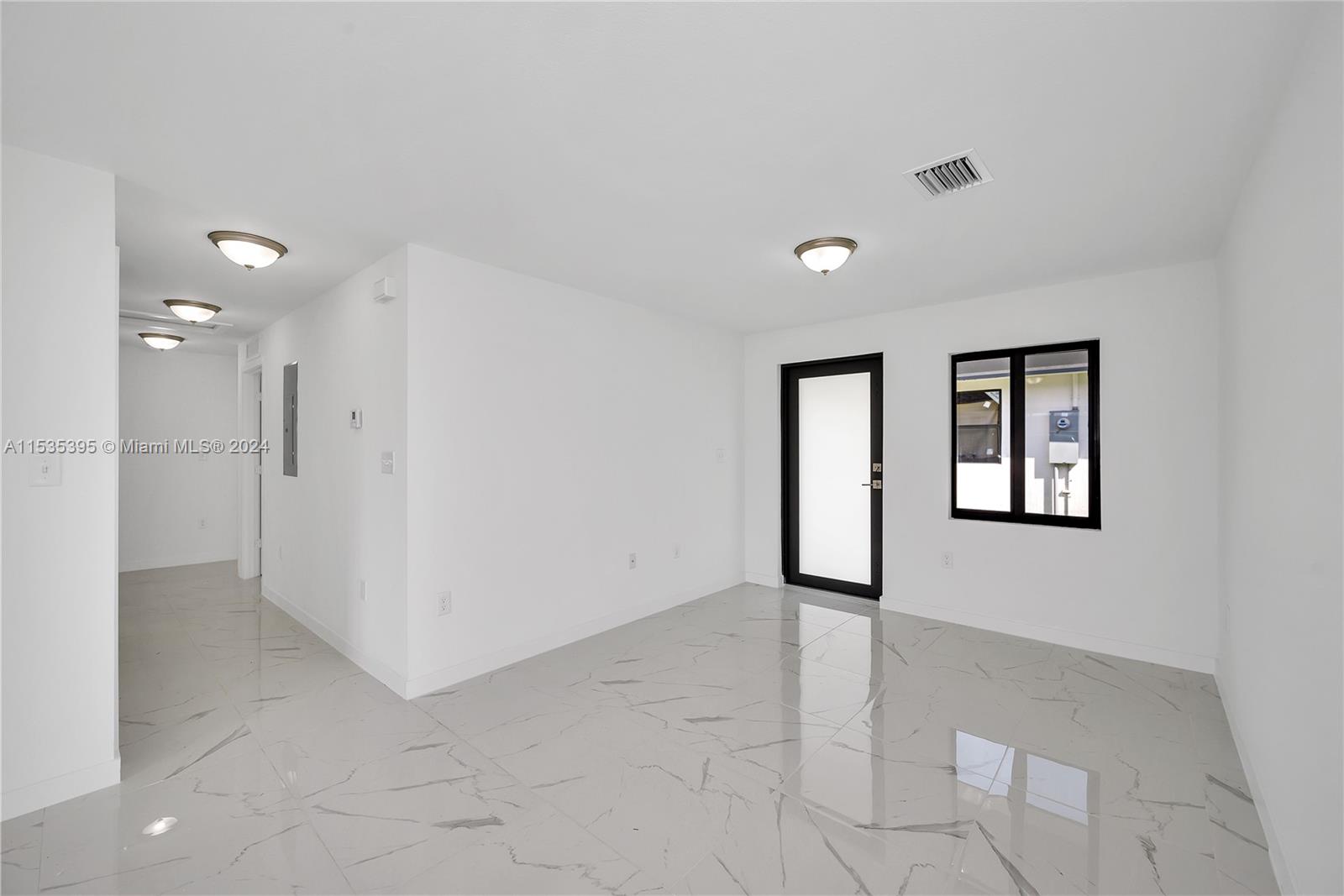 673 Northwest 14th Street, Unit 1 Florida City, FL 33034 - Photo 7 of 20 a view of livingroom with hardwood