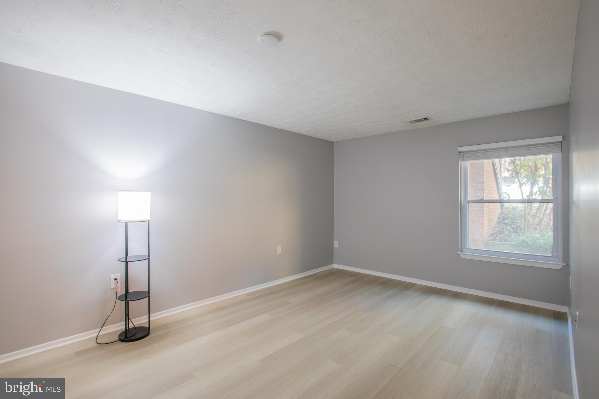 7537 Weather Worn Way, Unit A Columbia, MD 21046 - Photo 18 of 23 an empty room with a empty space and windows