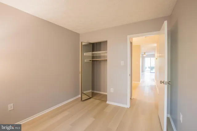 a view of a bathroom with washing machine and sink