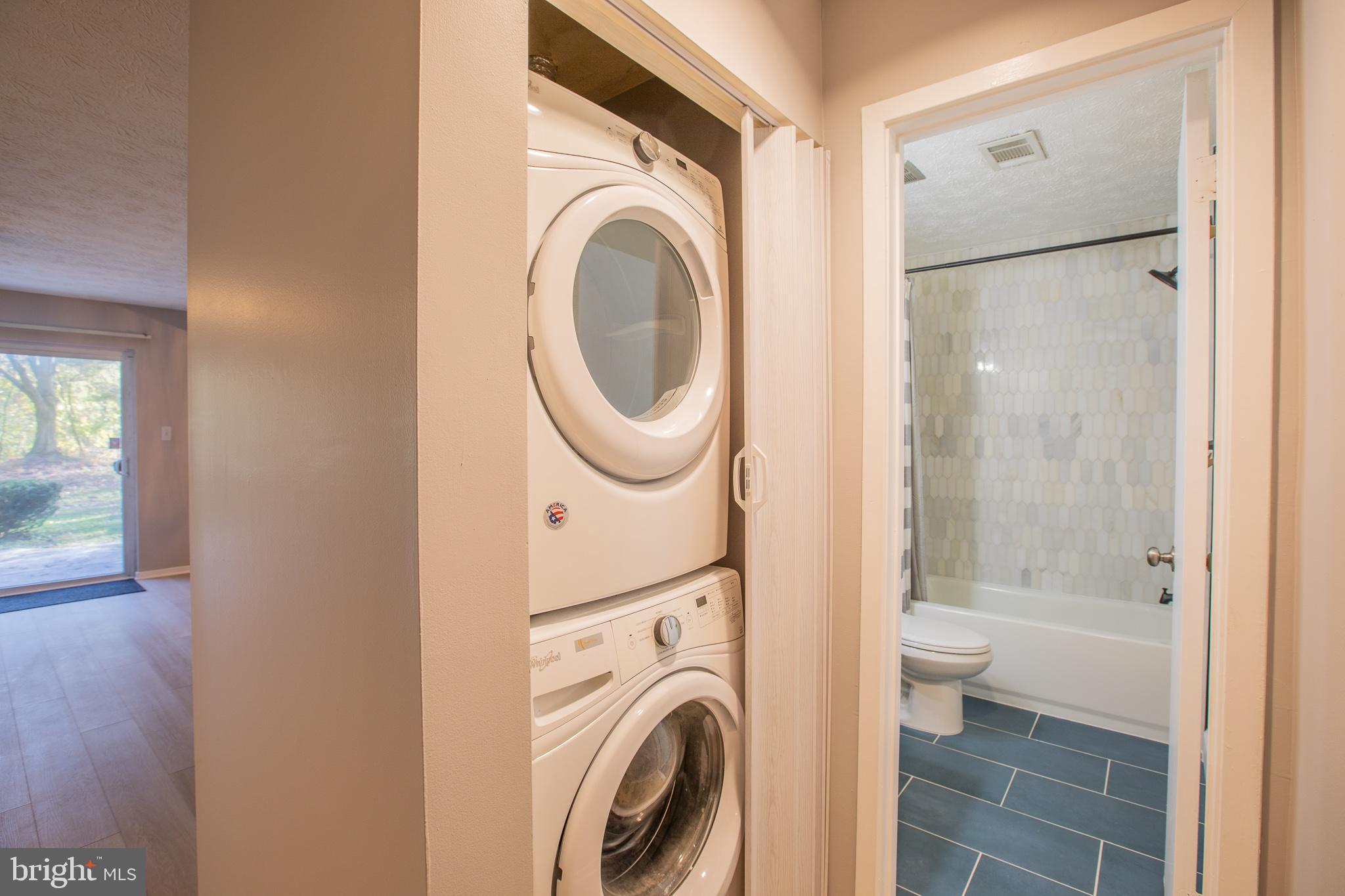7537 Weather Worn Way, Unit A Columbia, MD 21046 - Photo 22 of 23 a view of a bathroom with washing machine and sink