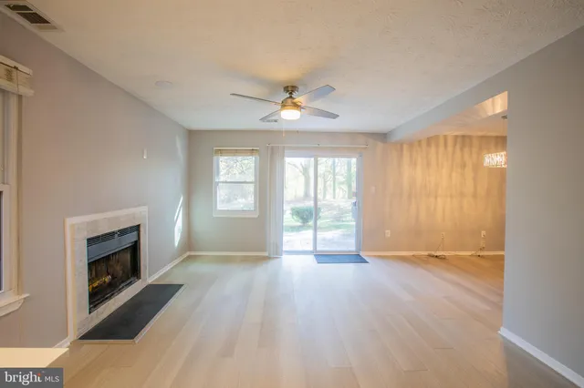 a view of a kitchen with a stove and a fireplace