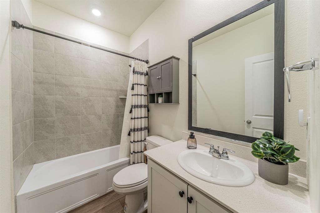 1240 Almond Road Azle, TX 76020 - Photo 15 of 26 Bath situated between bedroom 1 and 2