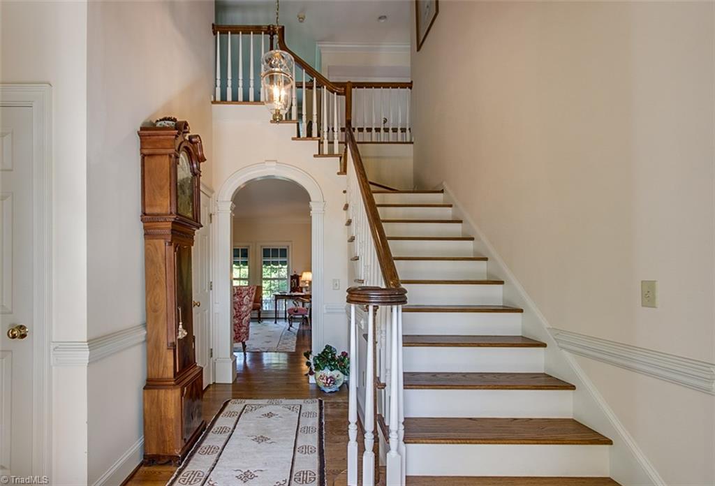2172 Stone Bridge Road Asheboro, NC 27205 - Photo 5 of 30 Entry way with main staircase and 1/2 bath. There is an addtional staircase leading to other bedroom & office area
