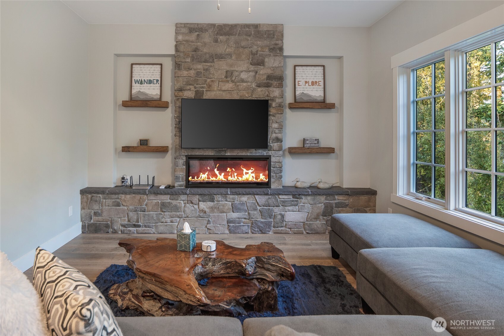 492 Finnegan Ridge, Unit 2 Friday Harbor, WA 98250 - Photo 4 of 29 a living room with furniture and a fireplace