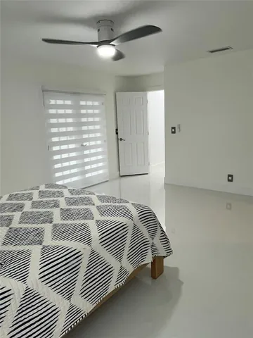 a bathroom with a toilet sink shower and mirror