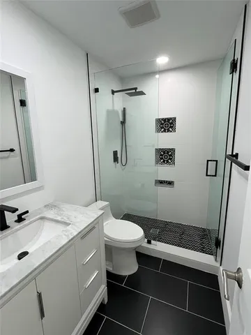 a utility room with sink dryer and washer