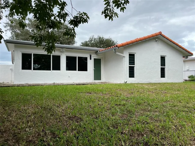 a view of a backyard of the house