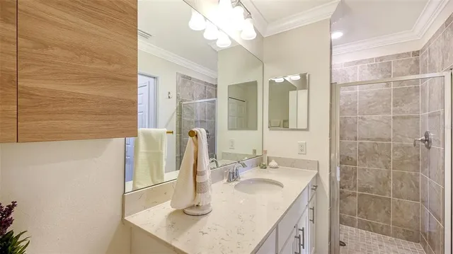 a living room with furniture wooden floor and a large window