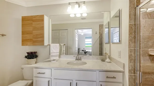 a kitchen with a sink cabinets and microwave