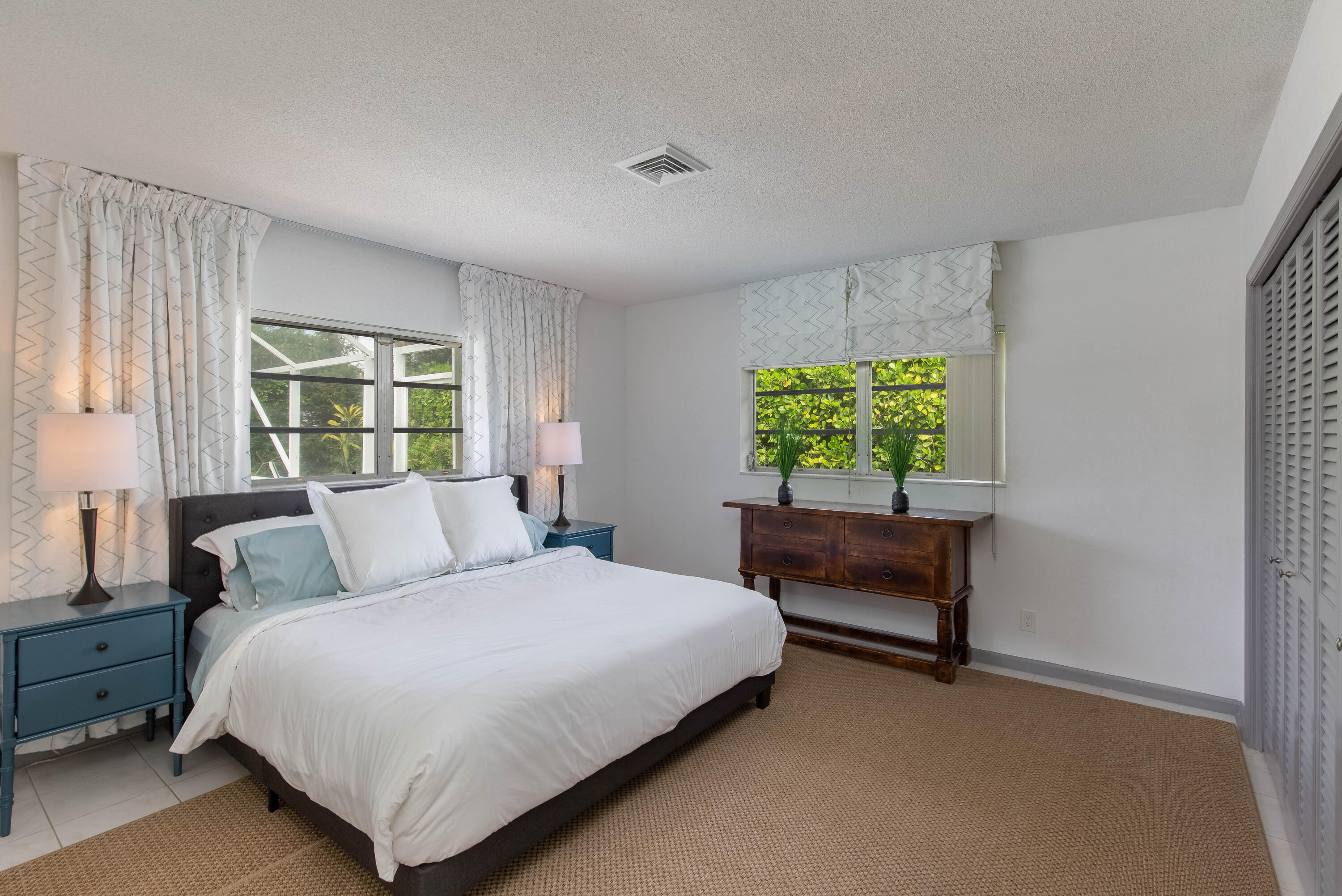 1323 Sugar Plum Drive Boca Raton, FL 33486 - Photo 12 of 28 a bedroom with a bed and a window