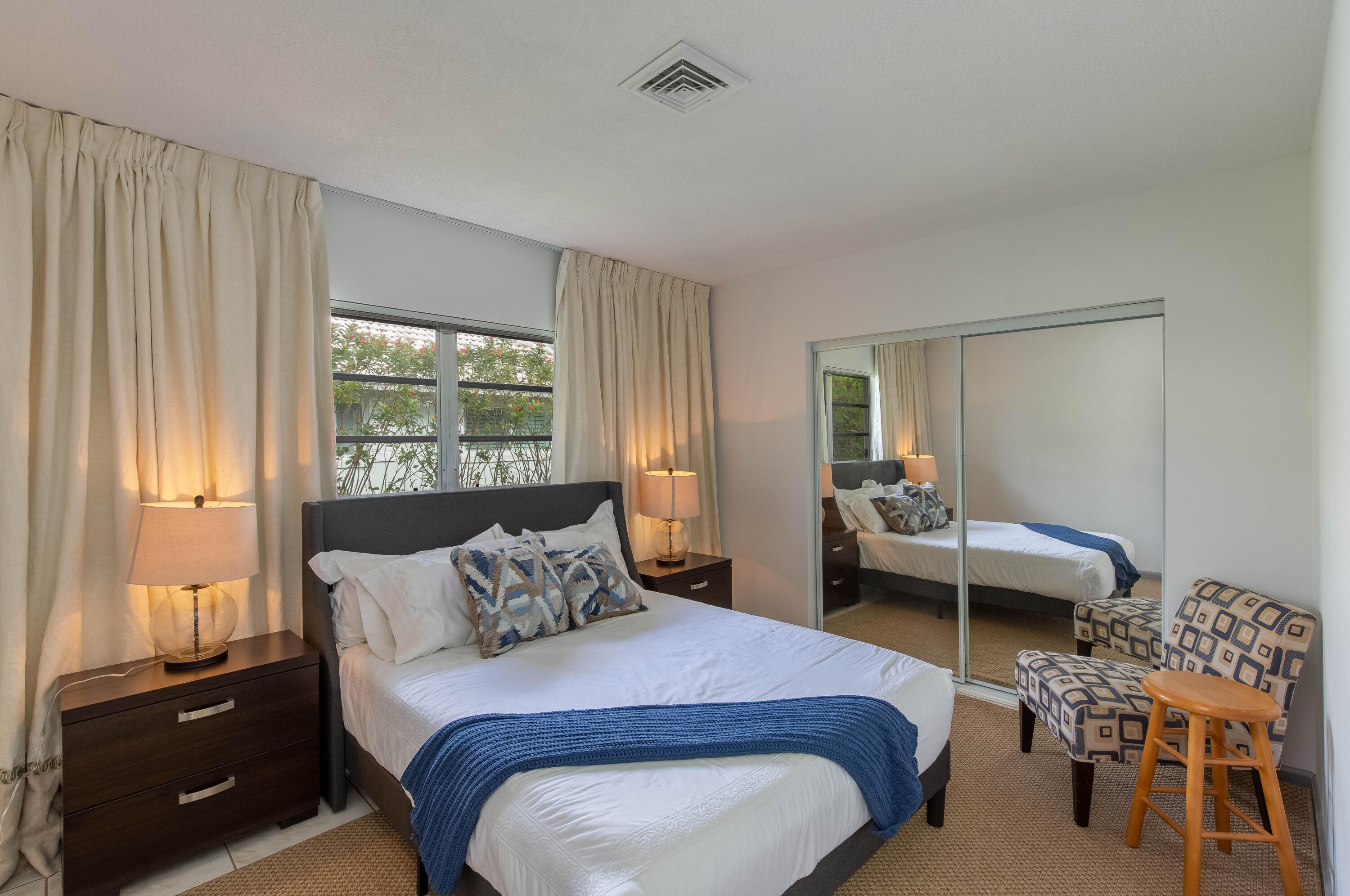 1323 Sugar Plum Drive Boca Raton, FL 33486 - Photo 15 of 28 a bedroom with a bed and a window