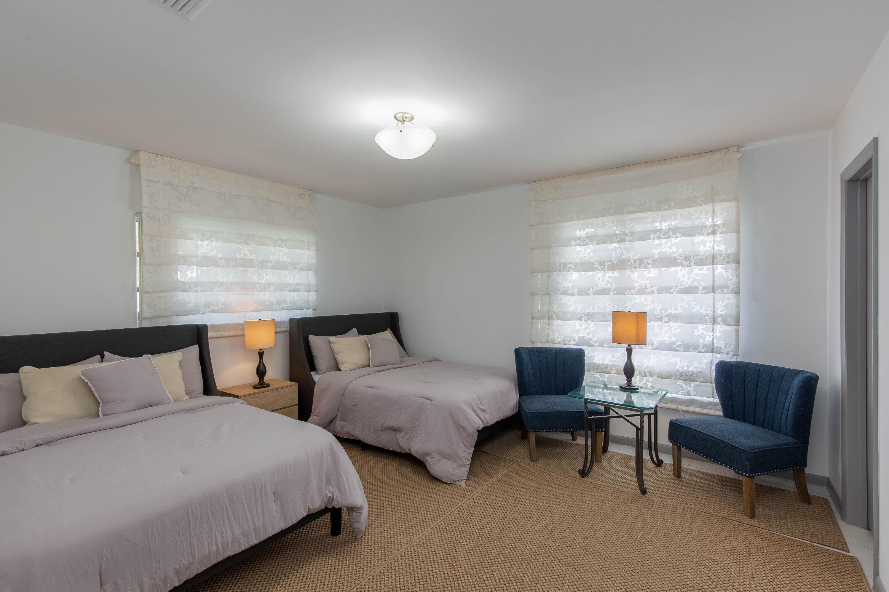 1323 Sugar Plum Drive Boca Raton, FL 33486 - Photo 16 of 28 a bedroom with two beds and a couch