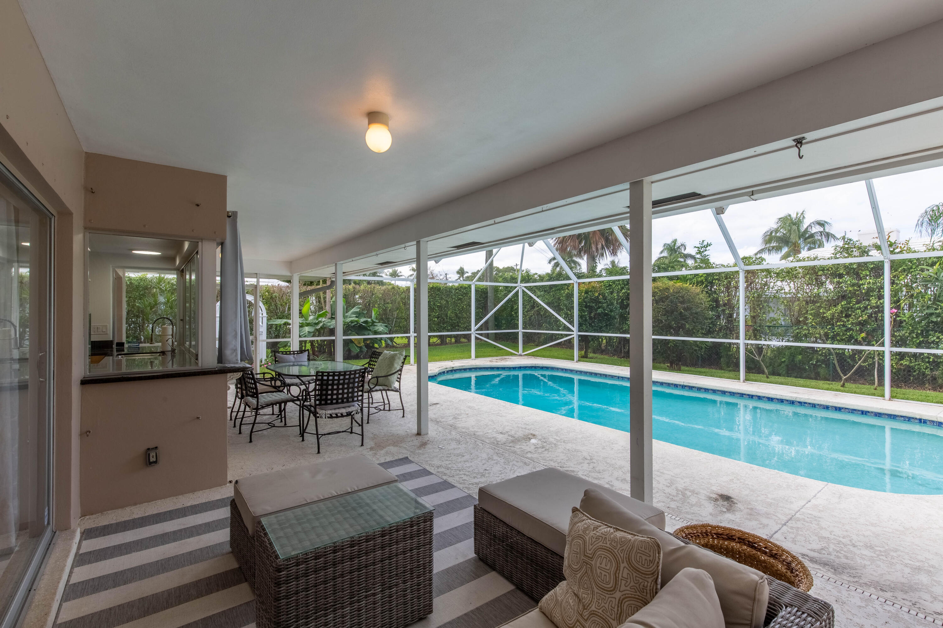 1323 Sugar Plum Drive Boca Raton, FL 33486 - Photo 18 of 28 a living room with furniture and a large window