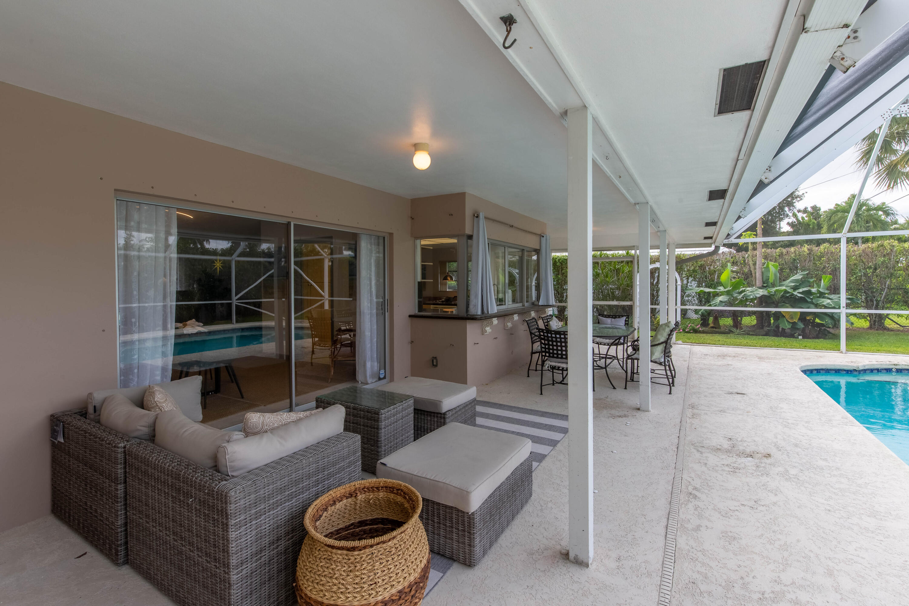 1323 Sugar Plum Drive Boca Raton, FL 33486 - Photo 19 of 28 a living room with furniture and a floor to ceiling window