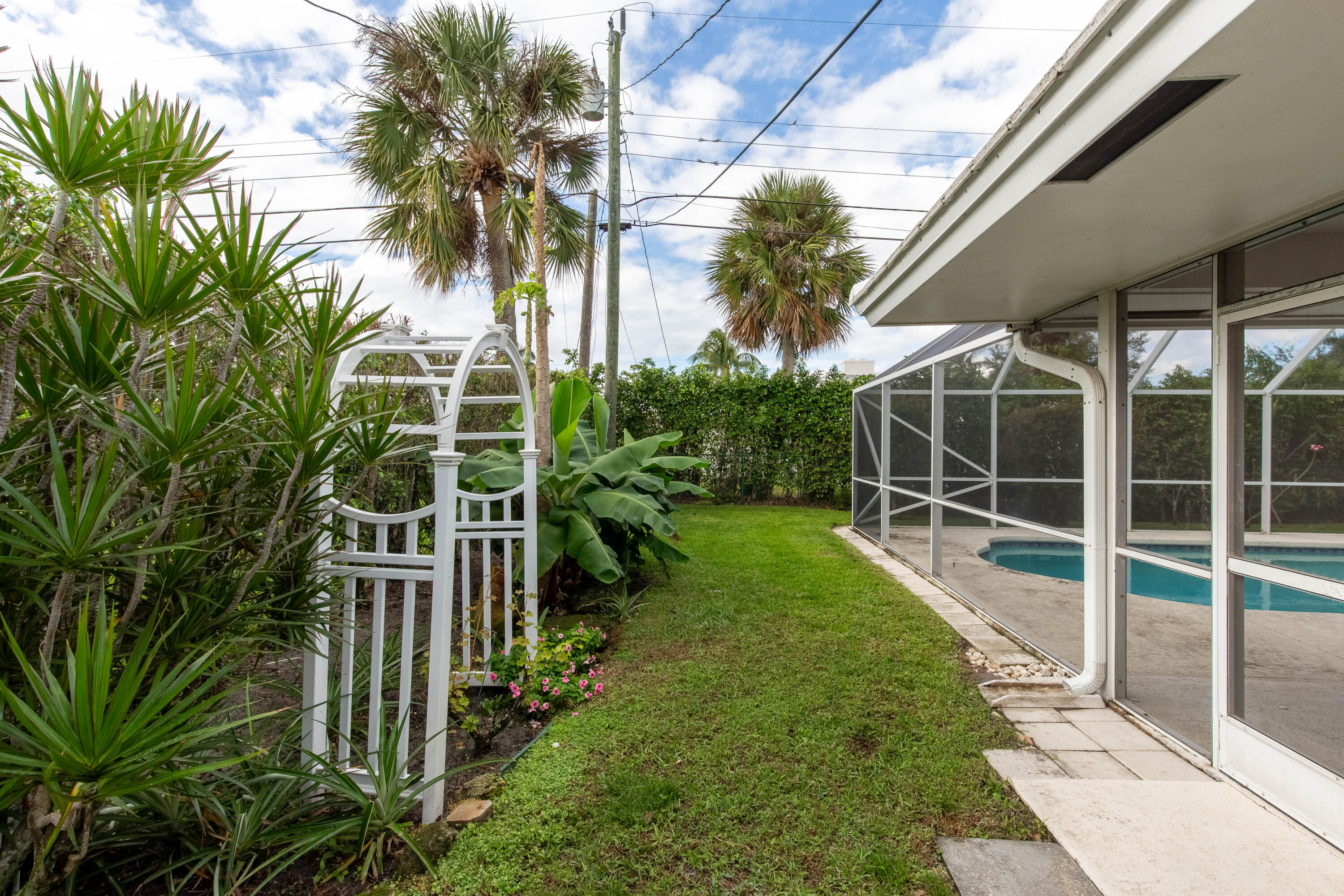 1323 Sugar Plum Drive Boca Raton, FL 33486 - Photo 21 of 28 a view of a backyard with plants