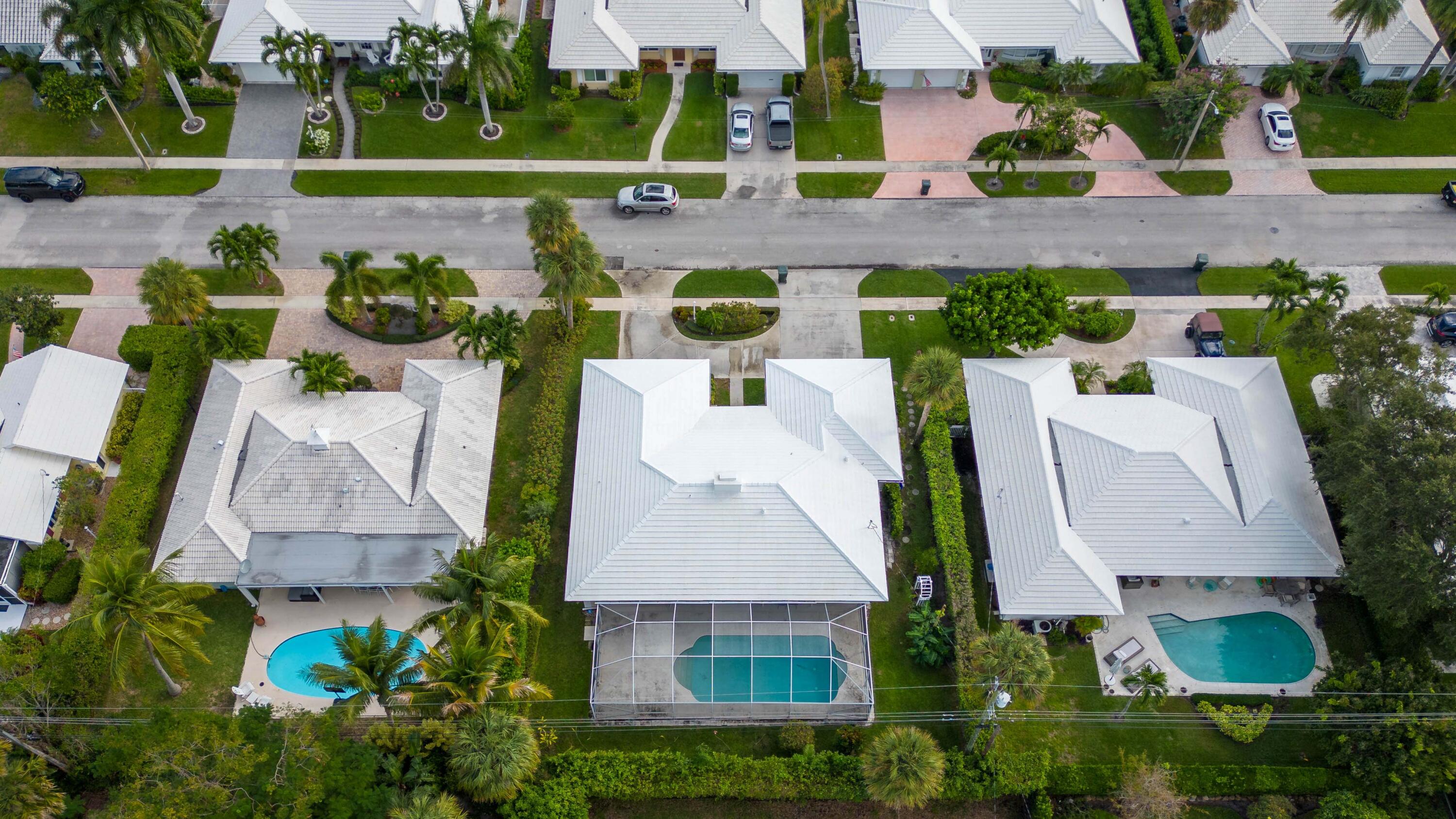 1323 Sugar Plum Drive Boca Raton, FL 33486 - Photo 22 of 28 an aerial view of a house with a swimming pool patio and outdoor seating