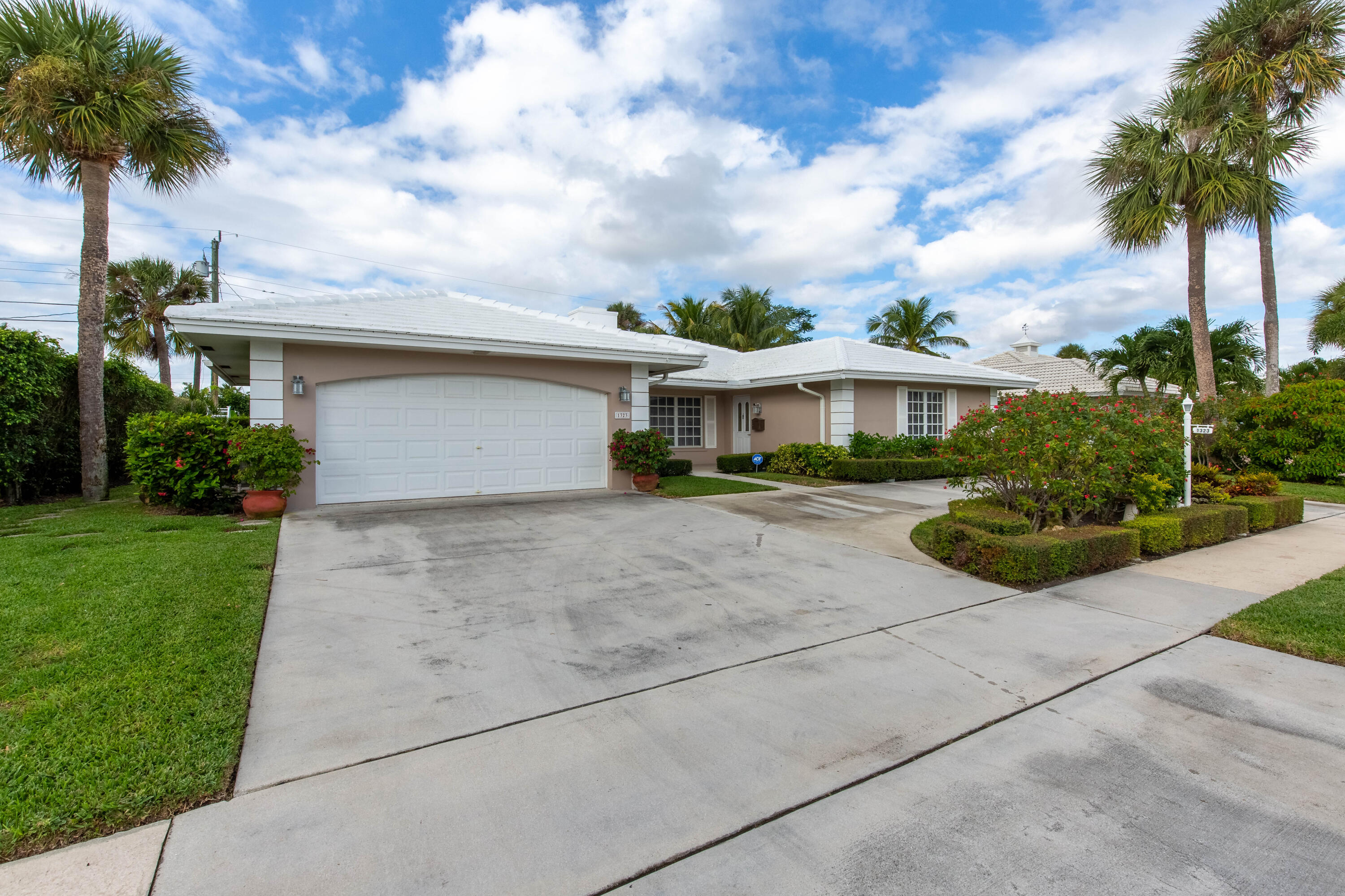 1323 Sugar Plum Drive Boca Raton, FL 33486 - Photo 27 of 28 a front view of a house with garden
