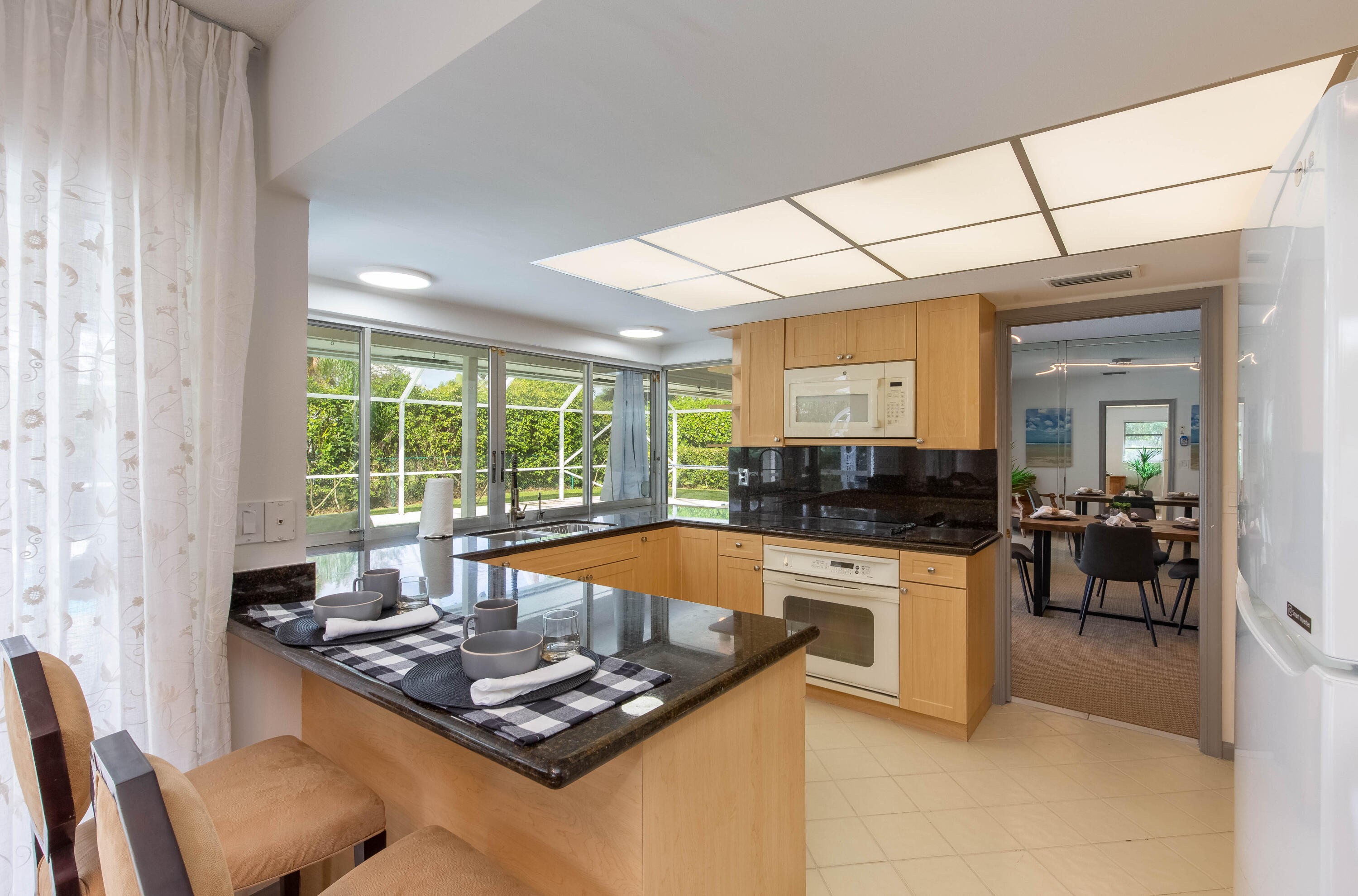 1323 Sugar Plum Drive Boca Raton, FL 33486 - Photo 5 of 28 a living room with furniture and large windows