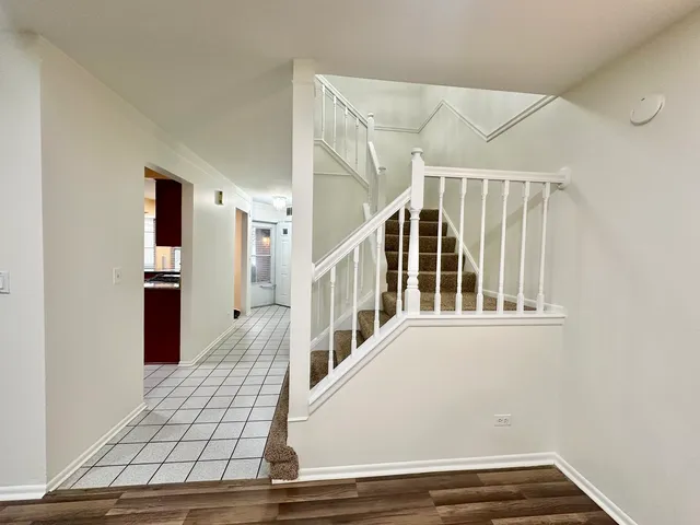 a view of a swimming pool with a patio and a yard