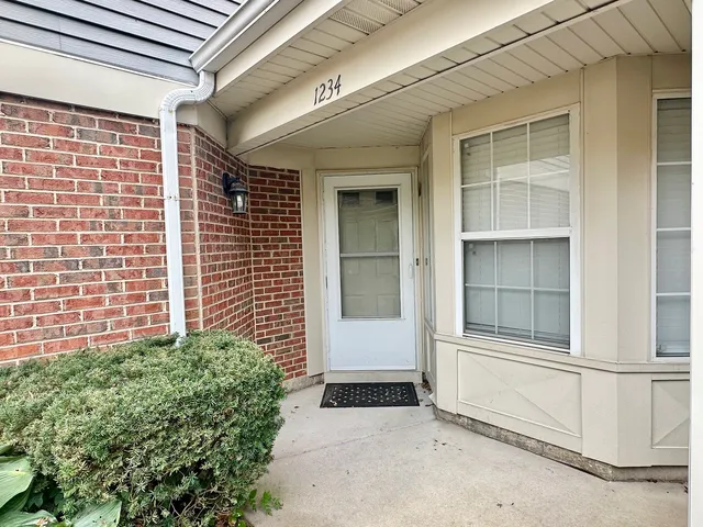 a kitchen with stainless steel appliances granite countertop a refrigerator sink and cabinets