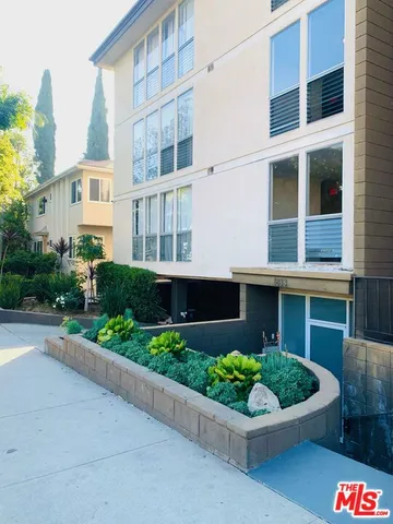 a front view of a multi story residential apartment building