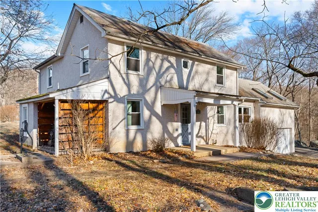 a view of a yard with a large tree