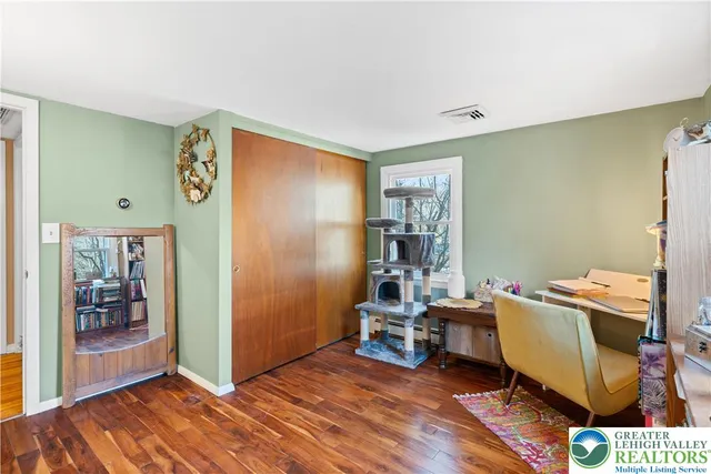 a room with window and air conditioner duct