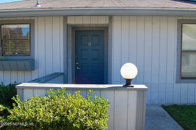 a view of a couple of cars parked in front of door
