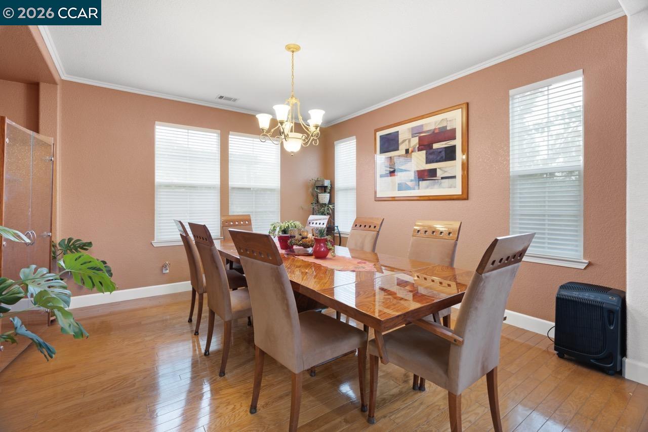995 Rosehedge Court Concord, CA 94521 - Photo 17 of 70 a view of a dining room with furniture window and wooden floor