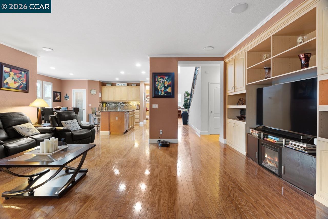 995 Rosehedge Court Concord, CA 94521 - Photo 27 of 70 a living room with furniture flat screen tv and wooden floor