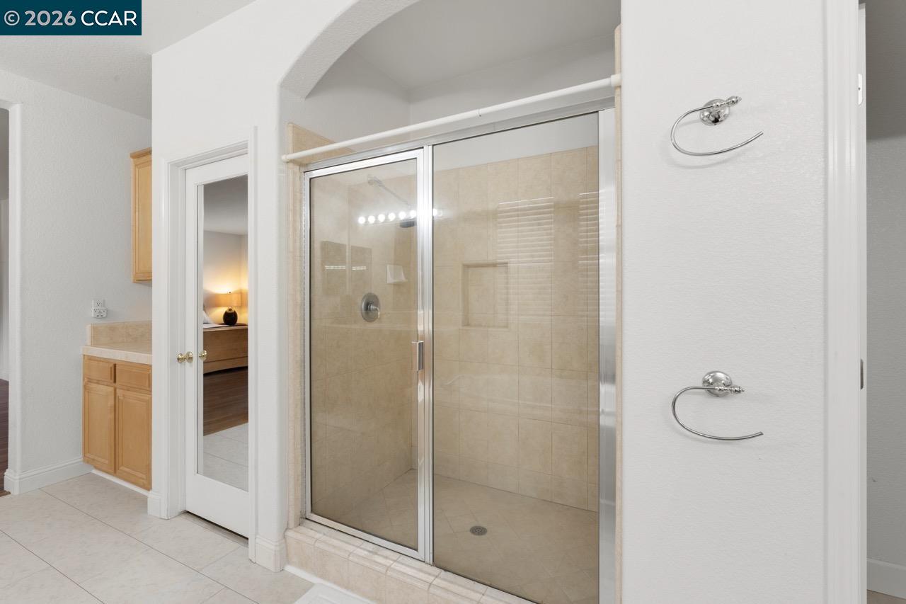 995 Rosehedge Court Concord, CA 94521 - Photo 42 of 70 a bathroom with a glass shower door