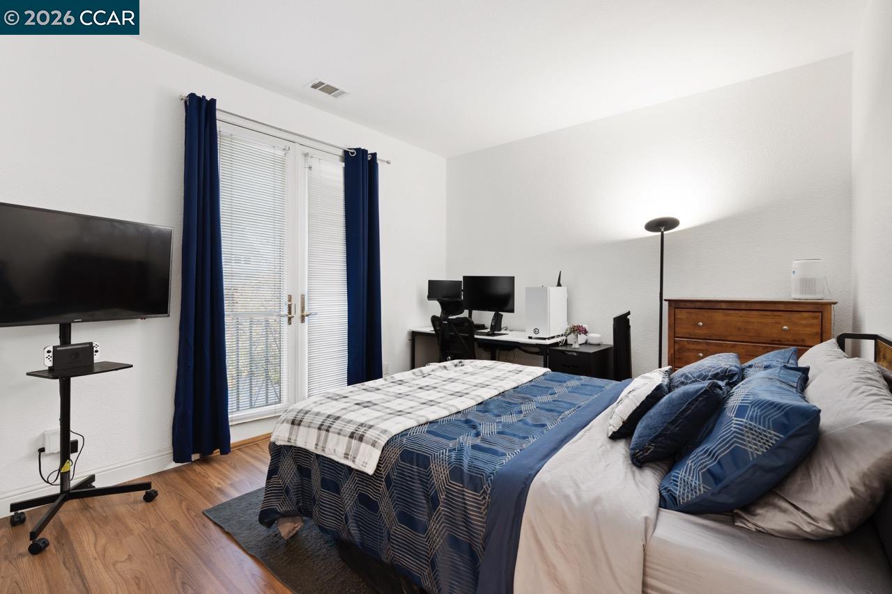 995 Rosehedge Court Concord, CA 94521 - Photo 46 of 70 a bedroom with a bed and a flat screen tv