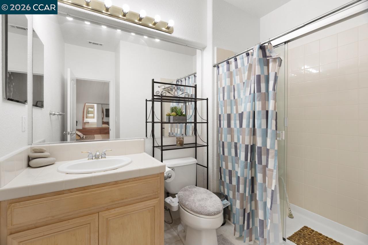 995 Rosehedge Court Concord, CA 94521 - Photo 54 of 70 a bathroom with a sink a toilet and shower