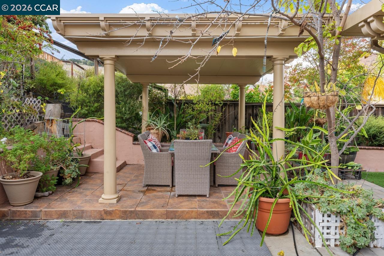995 Rosehedge Court Concord, CA 94521 - Photo 57 of 70 a view of a patio with table and chairs potted plants