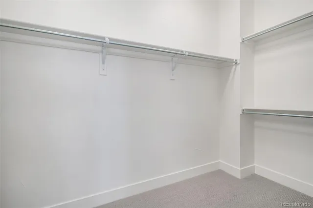 a view of an empty walk in closet