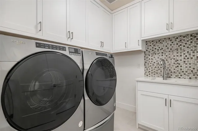 a utility room with dryer and washer