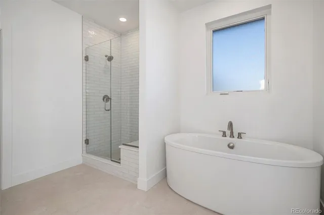 a white bath tub sitting next to a white sink