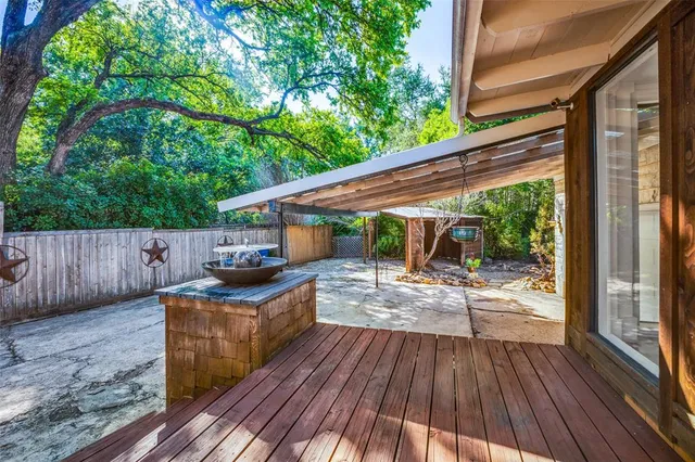 a balcony with wooden floor