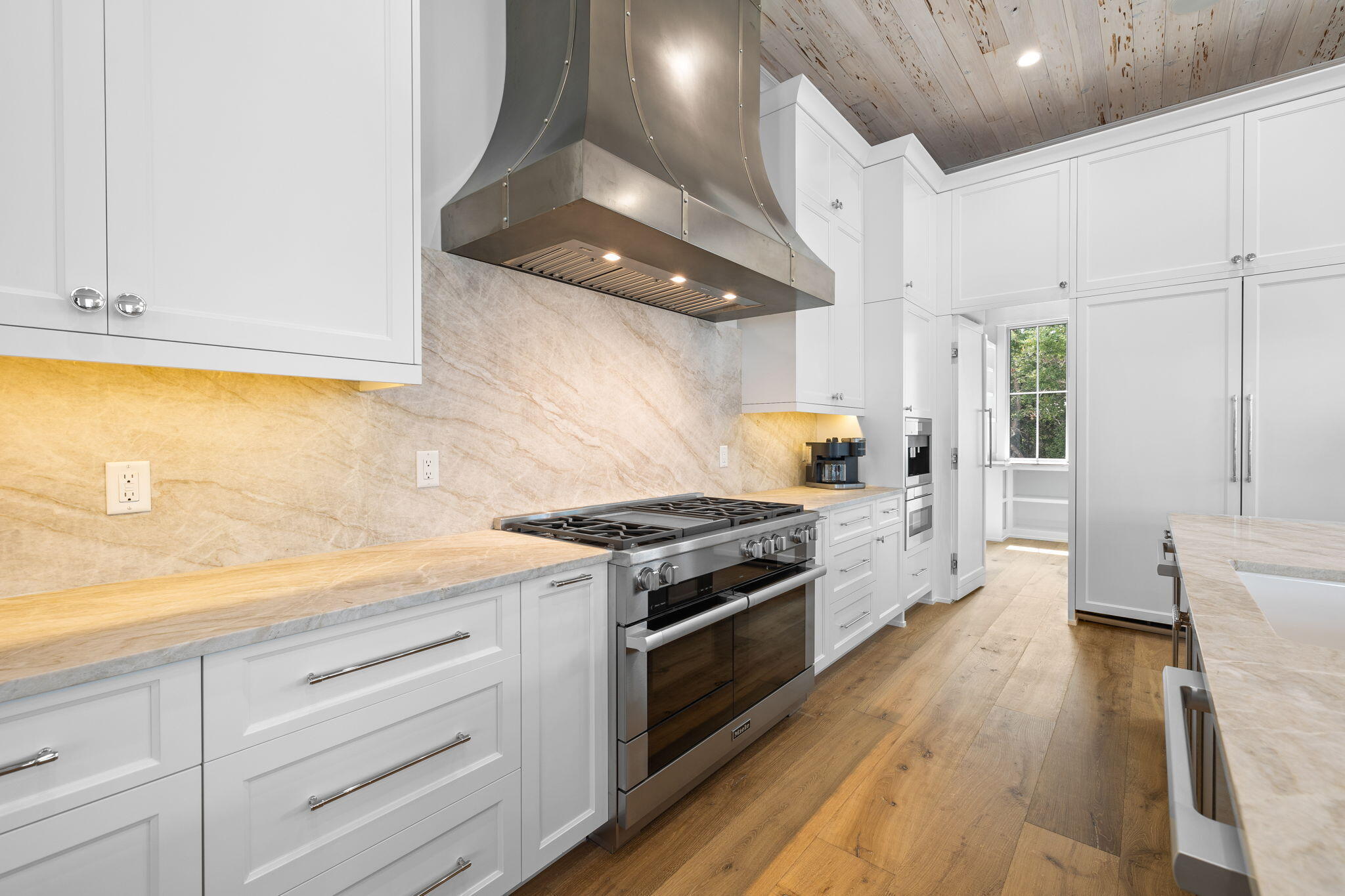 57 Azalea Street Santa Rosa Beach, FL 32459 - Photo 27 of 66 a kitchen with granite countertop a stove and a sink