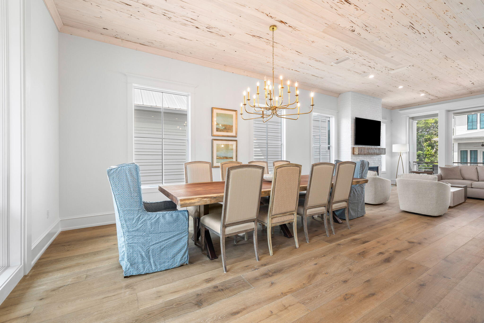 57 Azalea Street Santa Rosa Beach, FL 32459 - Photo 30 of 66 a view of a dining room with furniture a chandelier and wooden floor